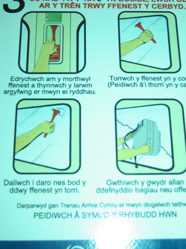 emergency evacuation signs in welsh on the local train
