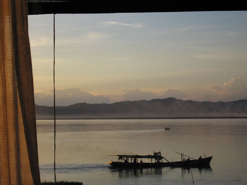 view from our bed. we would lie here for hours watching the river - a lone fisherman in his little boat, a barge slowly drifting by
