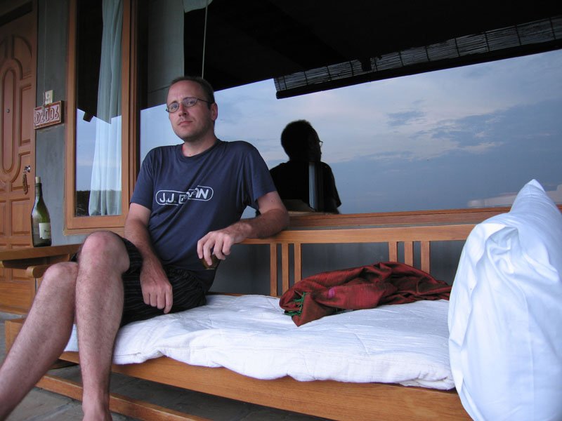 chilling out with a bottle of wine on our verandah by the river
