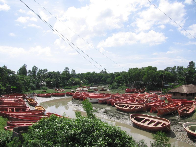 outside the shipbreaking yards, on the side of the highway.  lifeboats from ships.  all along this stretch of the highway, any salvageable items from the ships (other than the metal) are sold - from refrigerators to condiment bottles
