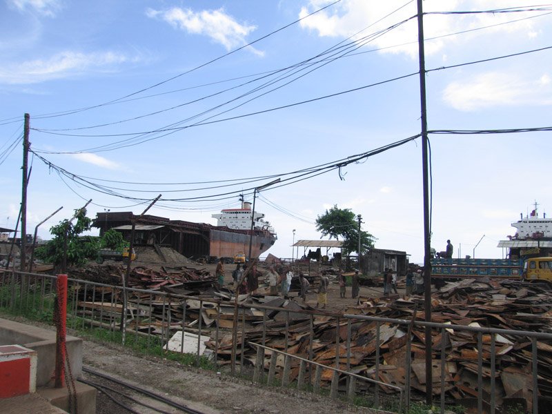 inside a shipbreaking yard. scrap metal piled up
