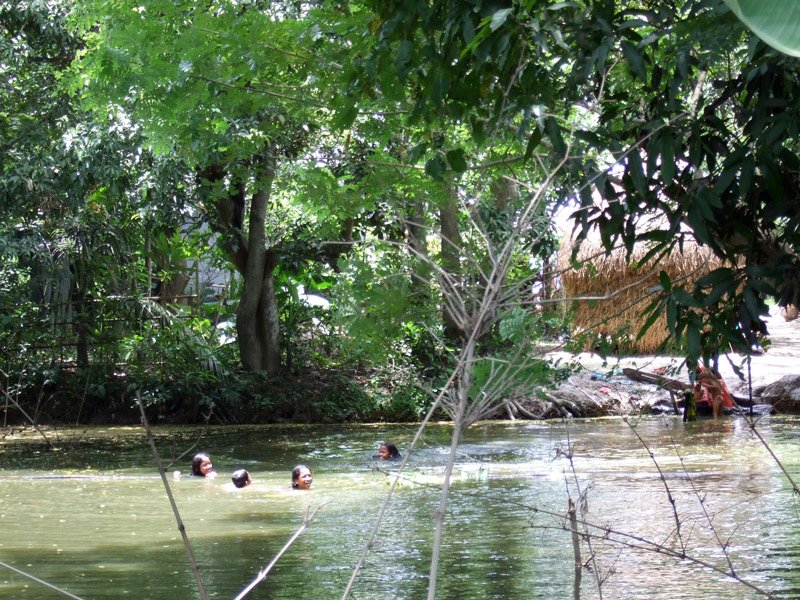 girls bathing in the village pond
