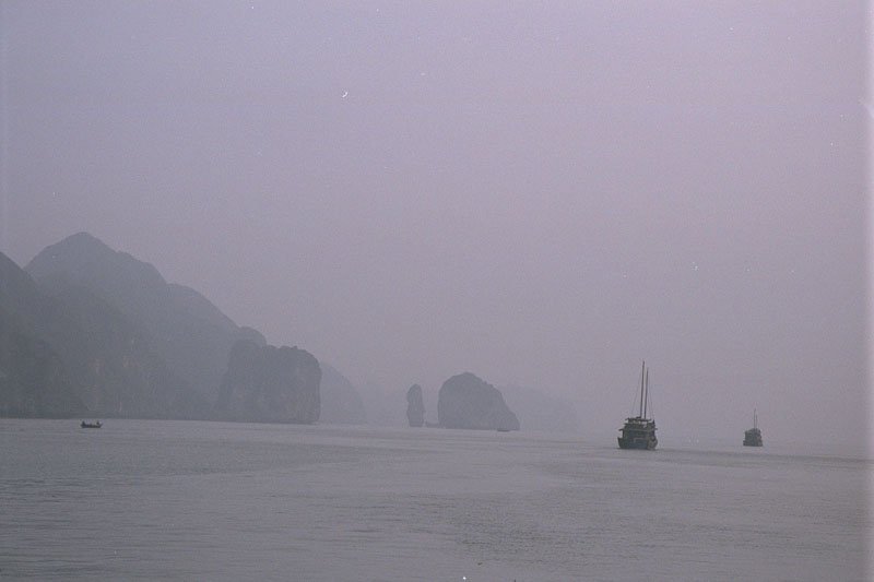 we were shrouded in mist & fog as our boat wove through these incredible limestone formations in the south china sea.  once in a while, through the fog, we'd see a boat appear all of a sudden in front of us
