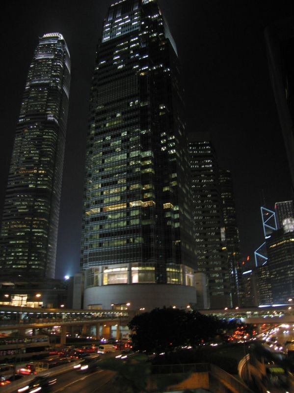 the two ifc buildings at night
