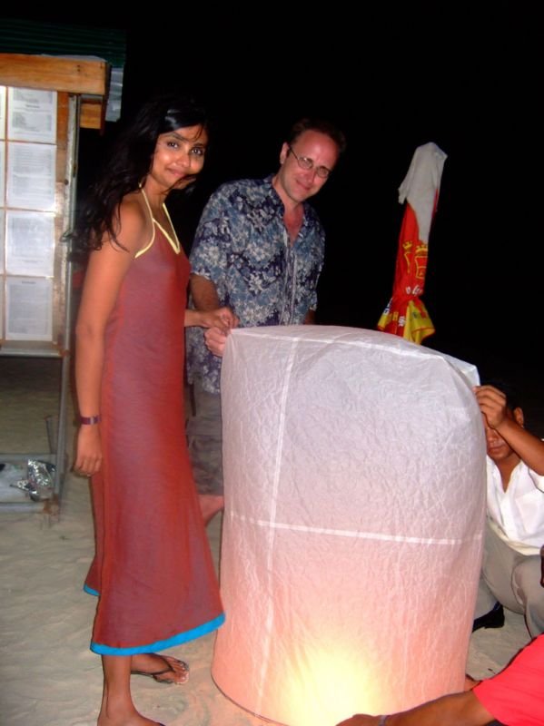 we had bought a paper hot air ballon, here we are inflating it to let it go
