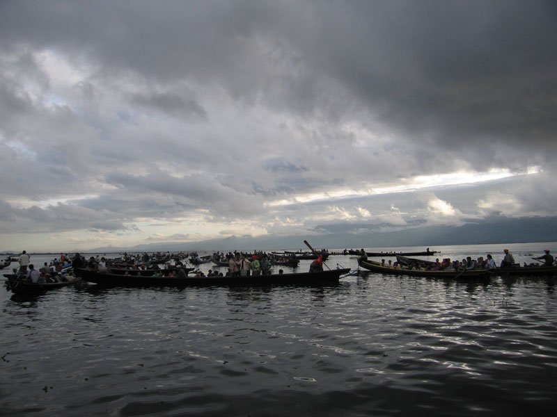 Inle Lake filling up with boatloads of people.  thousands of people & the many tribes of Shan State come for pilgrimage at this time (the town of Nyaung Shwe was packed for the festival with fairs, food stalls - excitement was in the air everywhere)
