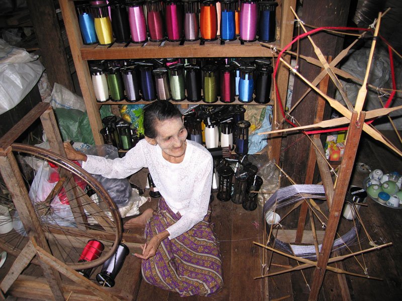 spinning silk. this woman was so old, hard to believe she was still working
