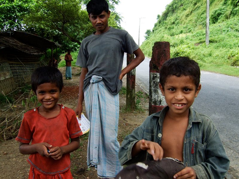 kids on the side of the road.  they were so excited to see their photo on the digital camera
