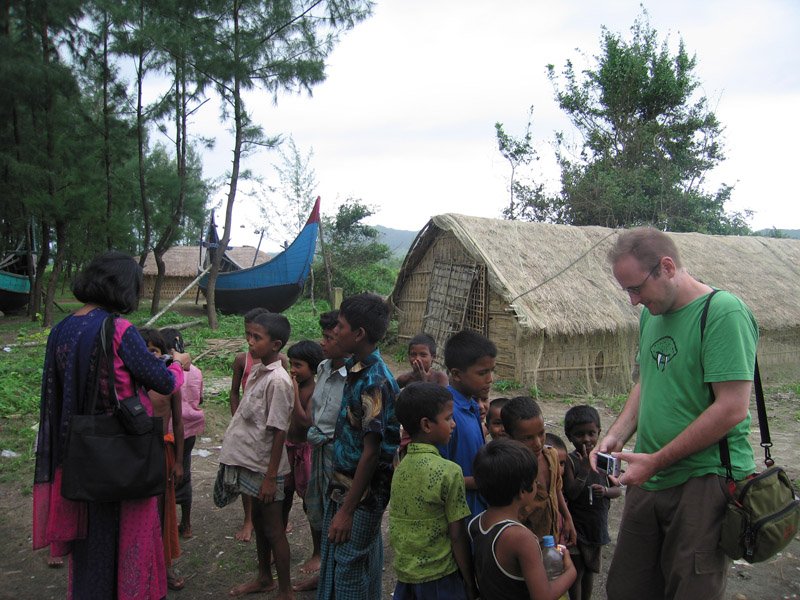 Ammu chatting with the kids, and Chuck showing them their photos on the camera. everyone in the villages is always excited to see themselves on the camera.
