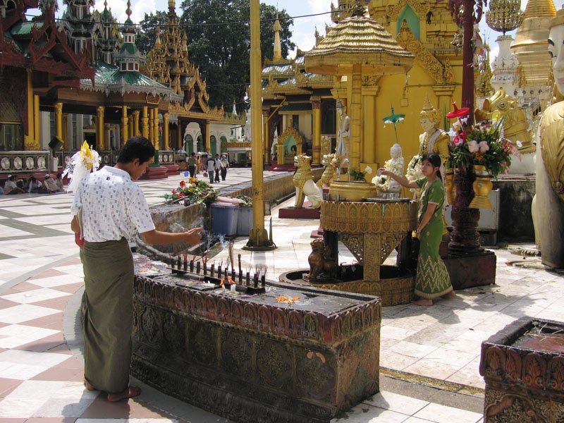 you have to walk in a clockwise direction around the Shwe Dagon.  there are areas for each day of the week - you light candles and give offerings for the day of the week you were born.
