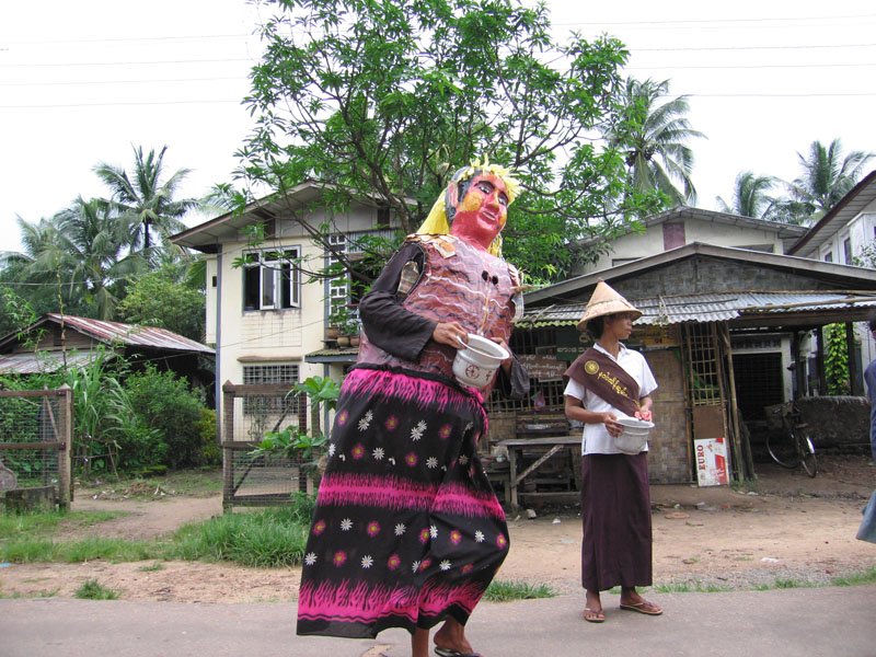 Burmese are always celebrating some Buddhist festival - one of the most spiritual countries i've been in, their lives truly revolve around religion. it was full moon day, everything was closed, & here's someone in a costume collecting alms
