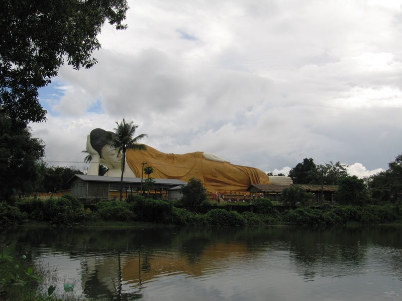 an outdoor reclining buddha as we're driving by
