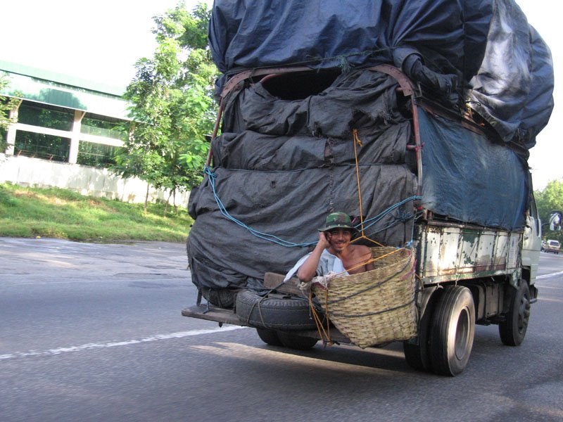 this guy was literally hanging in a basket from the back of the truck on the highway, incredibly bizzare
