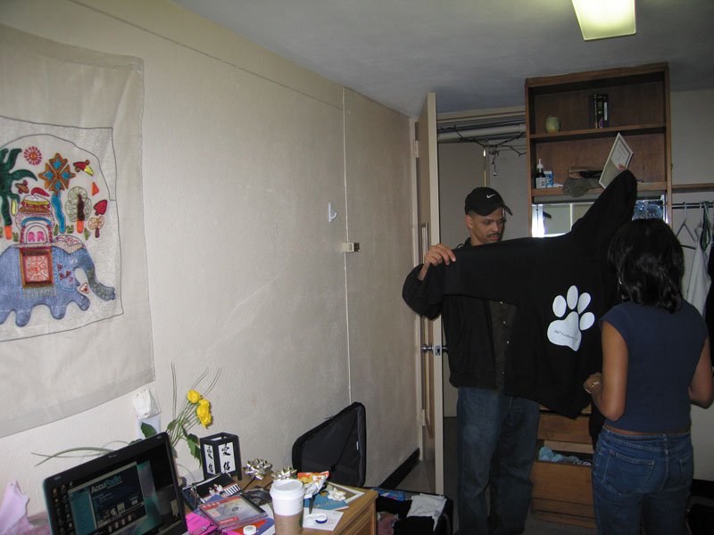 Zaynah showing her friend the sweatshirt she designed for her graduating class that all seniors got to buy
