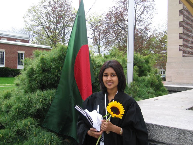 Zaynah with the Bangladesh flag by the stage
