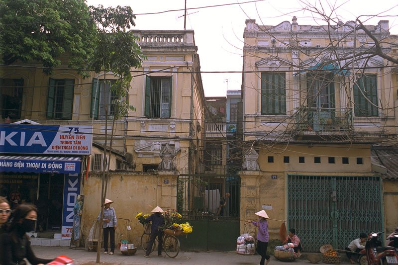 street vendors, all women - selling cooked food, flowers, clothes, fruits
